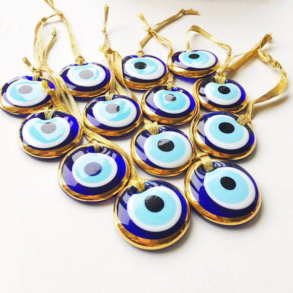 Gold trimmed glass evil eye beads with gold ropes
